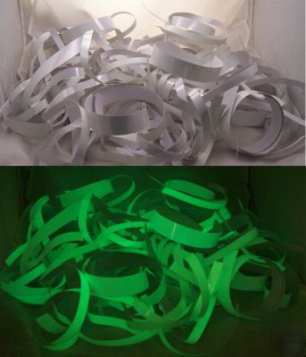 Pile of glow in the dark scrap adhesive tape pieces