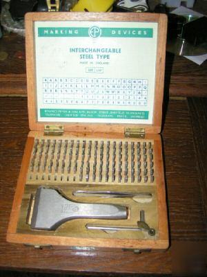 Steel type punch lettering set holds 13 letter at once