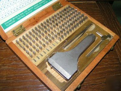 Steel type punch lettering set holds 13 letter at once