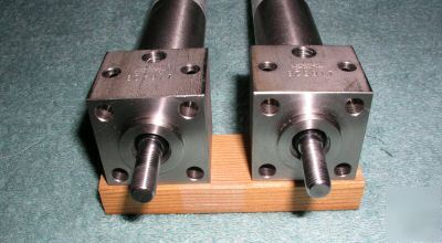 Two aurora 11SS11C44E6K stainless steel air cylinders