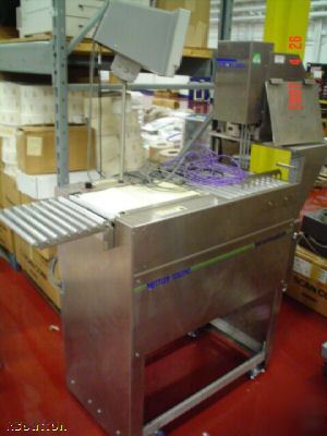 Toledo check weigher with auto ticket print and apply