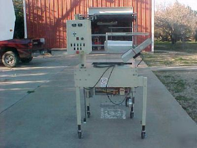 Rennco packaging machines - vertical l-bar bag machine