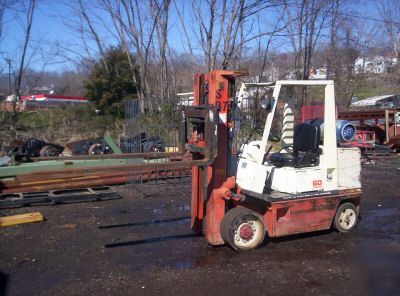 1998 forklift nissan 6000 solid tire runs great 6 forks